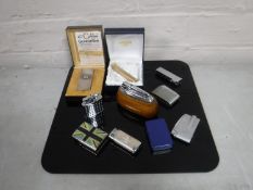 A collection of assorted lighters including Ronson, Calibri,