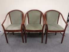 Three beech framed armchairs in green dralon