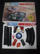 A boxed vintage Scalectrix Super Speed GT8 and a box of Lego