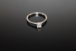 An 18ct white gold diamond solitaire ring, approximately 0.