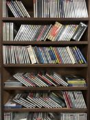 A CD rack containing assorted CDs - classical etc