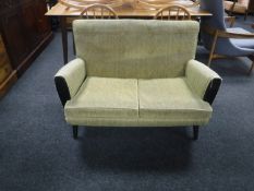 A mid 20th century two seater settee
