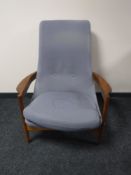 A mid 20th century teak framed designer armchair in the style of Hans Wegner,