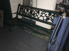 A cast iron and wood garden bench,