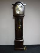 A mahogany cased Tempus Fugit grandfather clock with pendulum and key