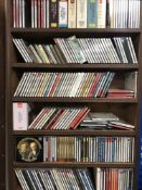 A CD rack containing assorted CDs - classical etc