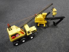 A Tonka tin plate excavator and a Tonka tin plate crane