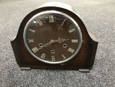 An oak cased Smiths mantel clock with pendulum and key