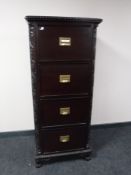 A reproduction mahogany four drawer filing cabinet on claw and ball feet