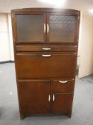 A mid 20th century kitchen cabinet