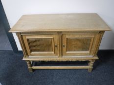 A continental blonde oak low sideboard