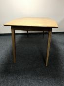 A mid 20th century teak dining table