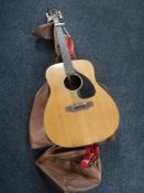 A Yamaha FG-140 acoustic guitar in carry bag