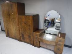 A walnut three piece bedroom suite