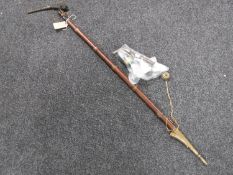 A long pipe with pipe bowls etc