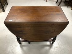 An oak barley twist gate leg table