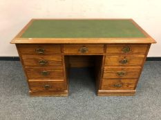 A 19th century pine pedestal desk