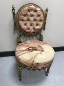 A 19th century continental gilded and painted bedroom chair