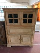 A light oak continental secretaire cabinet