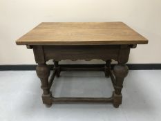 A 19th century oak side table fitted a drawer