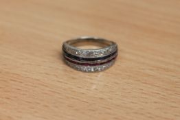 A diamond, sapphire and ruby half eternity ring,