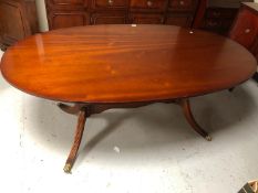 A reproduction mahogany dining room table together with an antique style sideboard