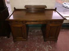 A 19th century walnut pedestal desk