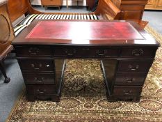 A reproduction mahogany twin pedestal desk red tooled leather top CONDITION REPORT: