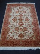 A Zeigler rug on rust ground, 1.9 m x 1.