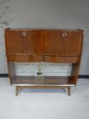 A mid twentieth century walnut cabinet