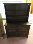 A carved oak dresser