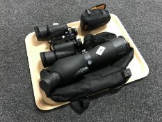 An Adventure Ridge spotting scope together with a pair of Revue 10x50 binoculars and a small set of