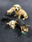 Five resin figures of dogs