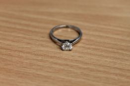 An 18ct white gold diamond solitaire ring,