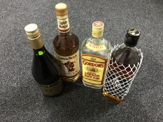 Four bottles of London Dry gin, King Robert II Scotch Whisky, Captain Morgan rum,