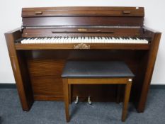 A mahogany cased mini piano by Eavestaff and stool