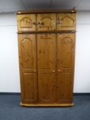 A pine triple door wardrobe