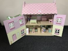 A pink Le Toy Van dolls house and furnishings