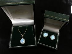 A 9ct gold opal and diamond pendant, approximately 0.