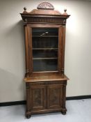A 19th century walnut bookcase fitted a drawer with cupboard below