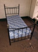 A 3' Victorian style metal bed frame with interior