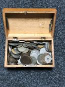 An old wooden box of various coins, copper coins,