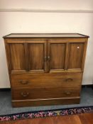 A late Victorian mahogany ecclesiastical cabinet fitted with drawers internally
