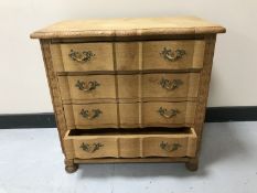A light oak four drawer chest