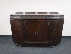 An early 20th century oak sideboard
