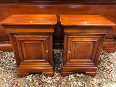 A pair of good quality mahogany bedside cabinets.