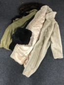 A lady's faux fur coat together with a black fur lined coat with muff CONDITION REPORT: