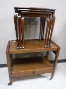 A mahogany nest of tables together with an oak trolley