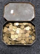 An old tin of three pence pieces