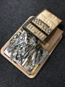 A tray of cutlery and silver plated wares